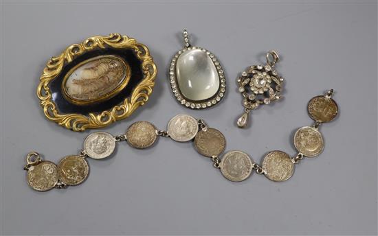 A Victorian pinchbeck and black enamel mourning brooch, two paste set pendants and a coin bracelet.